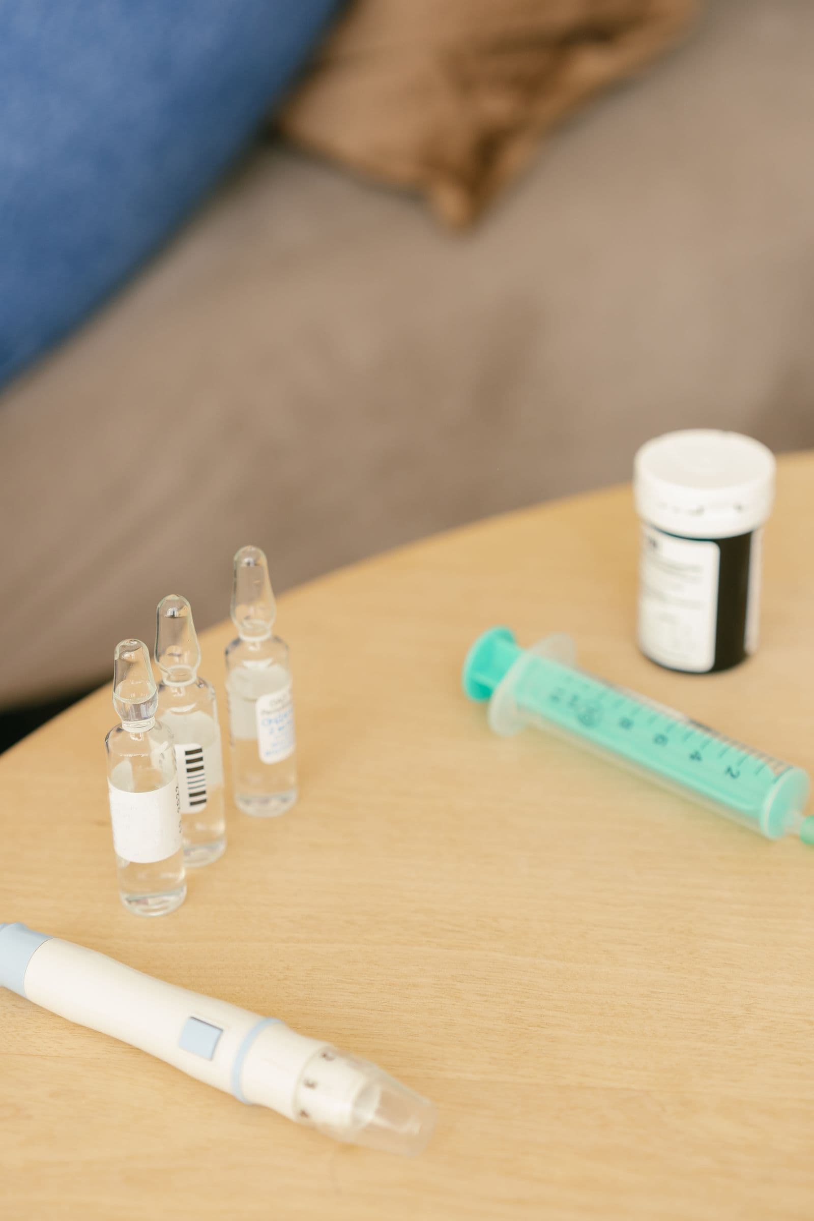 Glass ampoules and a syringe on a table, the research-chemical presentation clinics and catalogs recycle as a wellness product