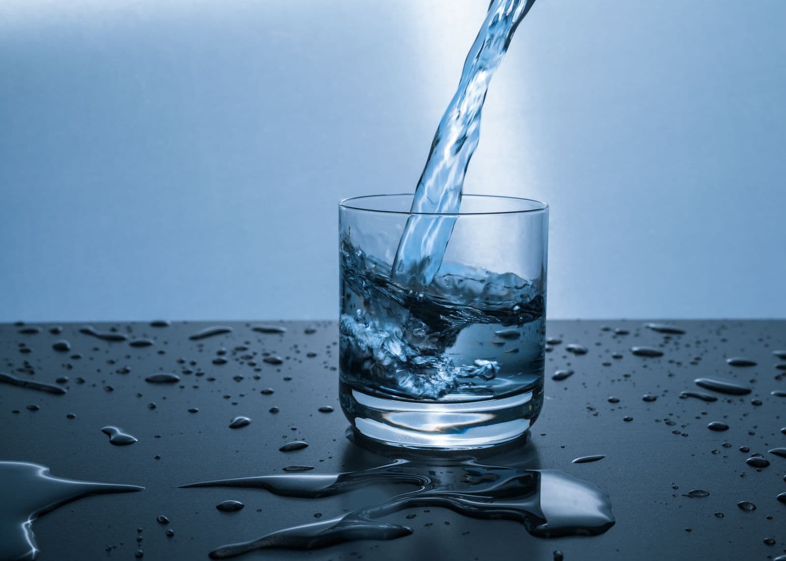 Water poured into a glass, the default drink on an ordinary day